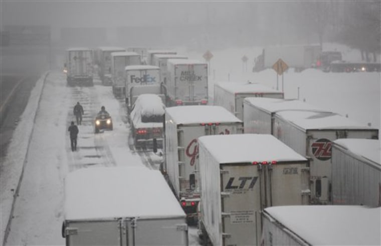 Vehicles are stranded on the New York State Thruway during a winter storm in Buffalo, N.Y., on Thursday.